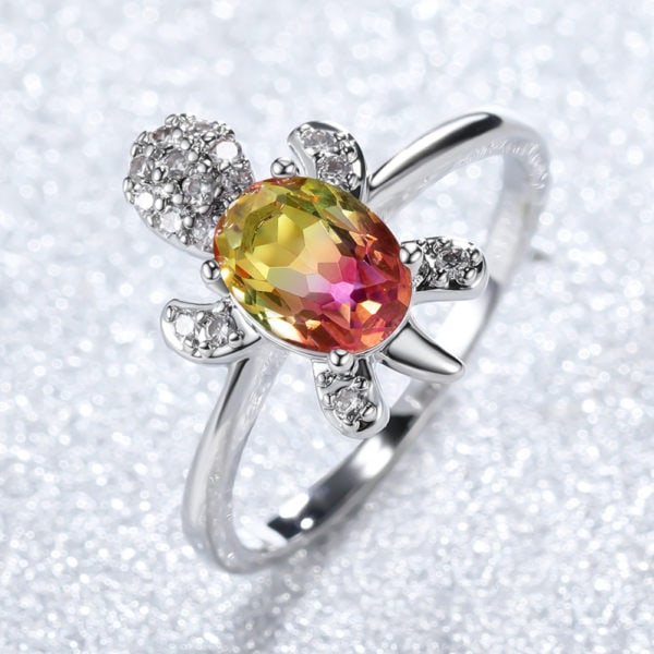 Bague Tortue en or blanc et diamant bleu